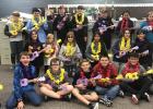 Elementary students learn the ukulele